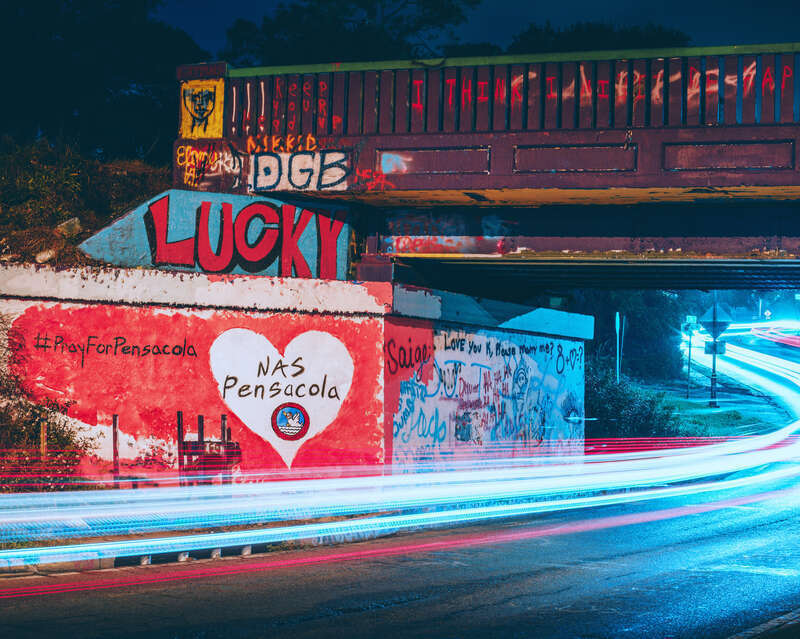 The Graffiti Bridge over 17th Avenue just before midnight on December 6, 2019 following the events at NAS Pensacola.  Painted by a local resident.