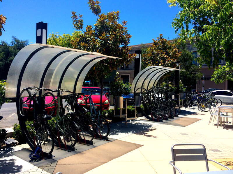 Half Arc by Bike Arc in Lytton Plaza (downtown Palo Alto, Ca.).  Bicycle parking/bike rack/bike storage.