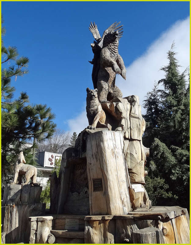 (1 in a multiple picture set)
This massive wood sculpture is called "Harmony."  It shows all the different species of the nearby forest living together in peace.  It is the highlight of Idyllwild's Sculpture Garden at the center of the village.