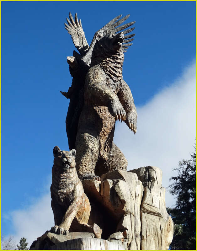 (1 in a multiple picture set)
This massive wood sculpture is called "Harmony."  It shows all the different species of the nearby forest living together in peace.  It is the highlight of Idyllwild's Sculpture Garden at the center of the village.