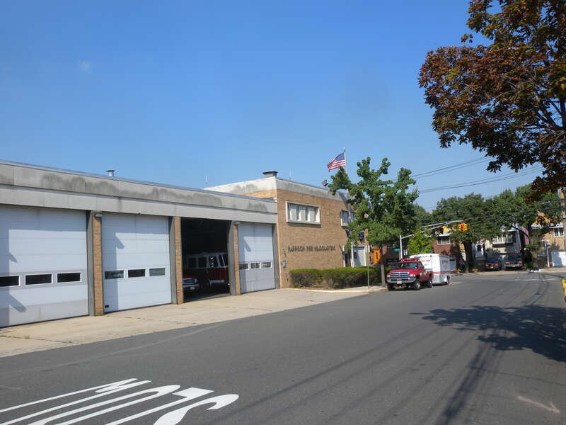 Harrison Fire Headquarters with HAZMAT truck parked outside.
