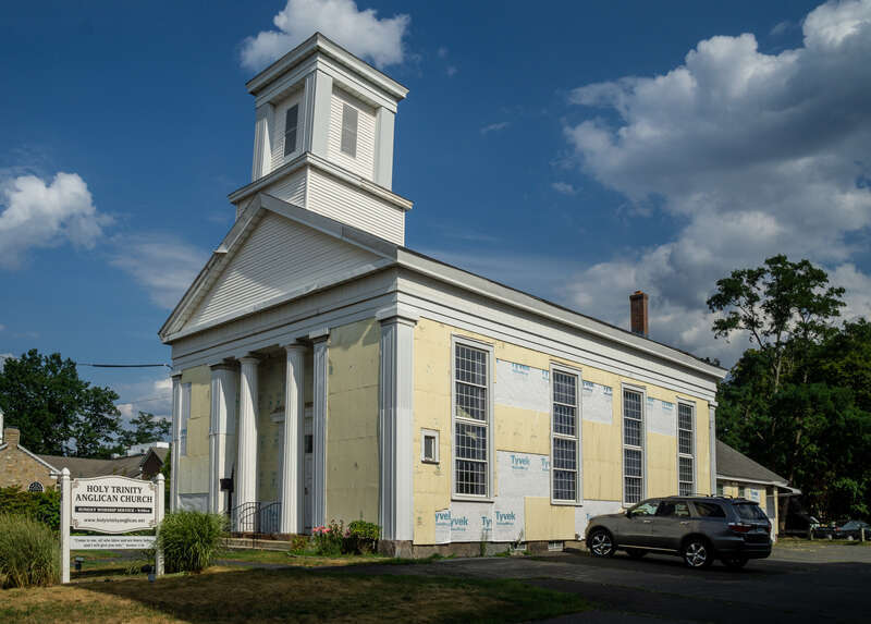 Holy Trinity Anglican Church, Plainville, Connecticut. Originally the First Baptist Church. "The First Baptist Church in Plainville was organized in 1851. The Greek Revival church was erected in December of that year at 18 East Main Street on land