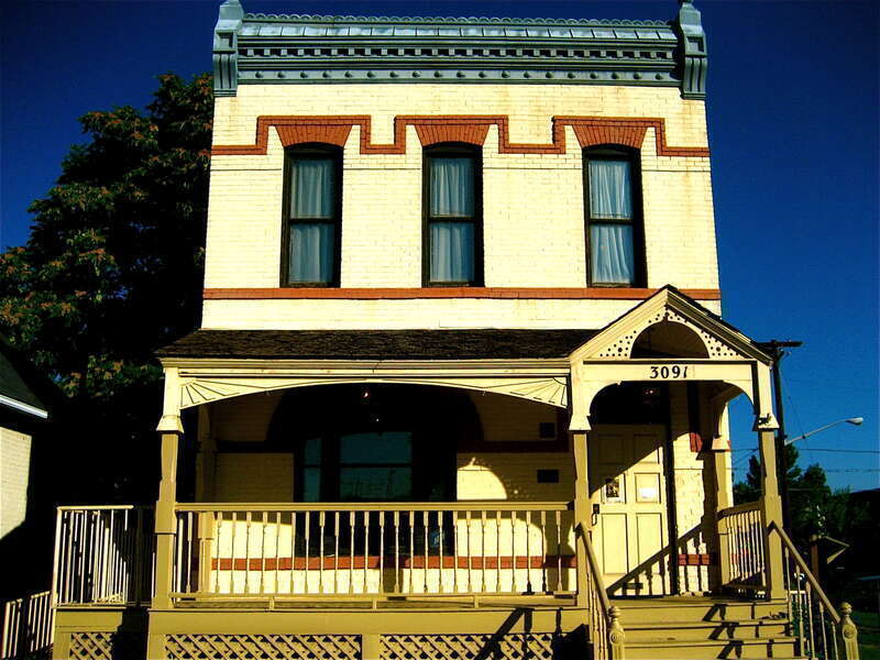 JUSTINA FORD HOUSE-3091 California Street. National Register 11/23/1984, 5DV.1493

Originally constructed at 2335 Arapahoe St. in 1890, the two-story flat roofed brick house sits on a stone foundation. Simple in massing and detailing, its most