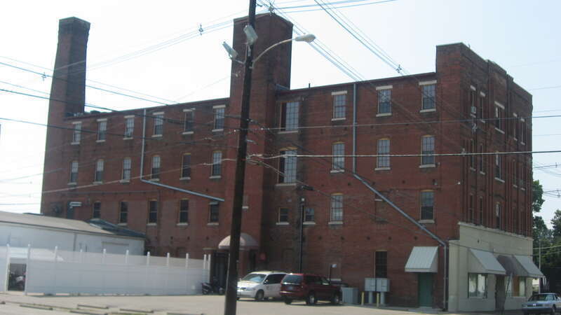 Front and side of the L. Puster and Company Furniture Manufactory, located at 326 NW. Sixth Street in Evansville, Indiana, United States.  Built in 1887, it is listed on the National Register of Historic Places.