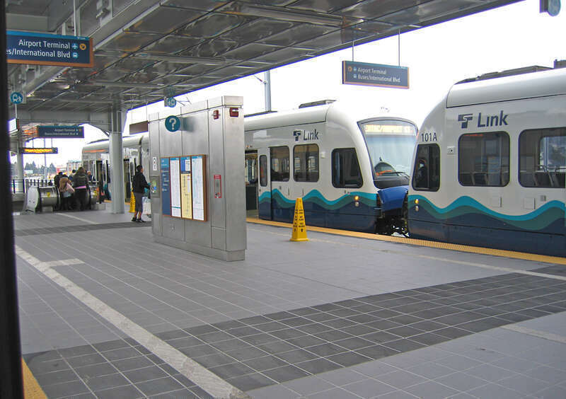 Riders leaving light rail train for airport.
This work is licensed under a
Creative Commons Attribution 3.0 United States License.

Please Attribute to:  Brett VA