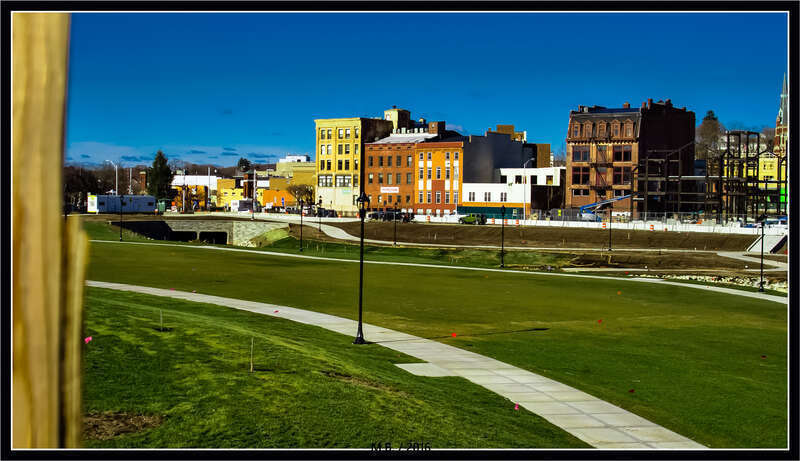500px provided description: Downtown Meriden, CT taken from Pratt Street, through the fence of the new park being built at the HUB. The park seems to be coming along nicely. I used my Tamron 28-80mm Zoom Lens for this image, taken at 9:15a.m. this