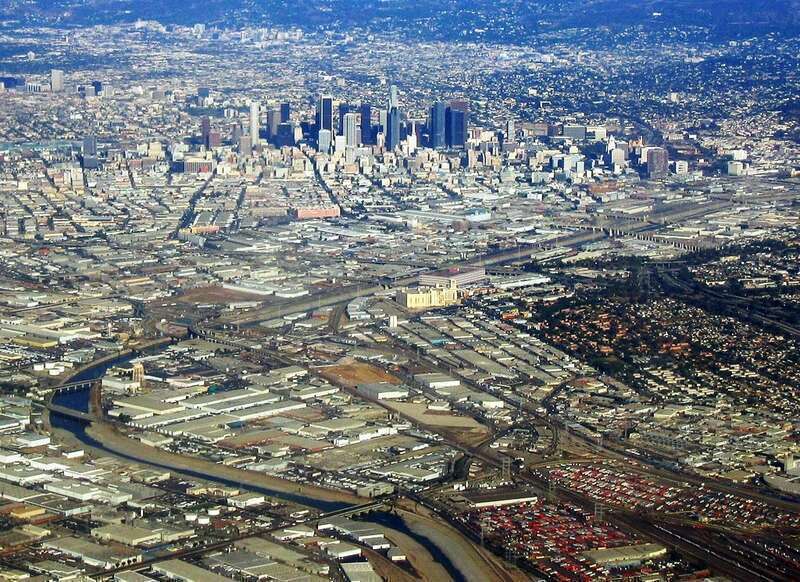 The Los Angeles River in Eastside Los Angeles, Southern California. 
Downtown Los Angeles rises in the background.