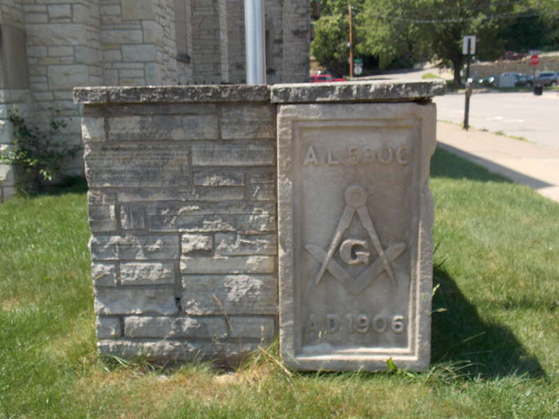 The base of the flagpole in front of the  Masonic Temple in Dubuque, Iowa, a contributing property in the Jackson Park Historic District.