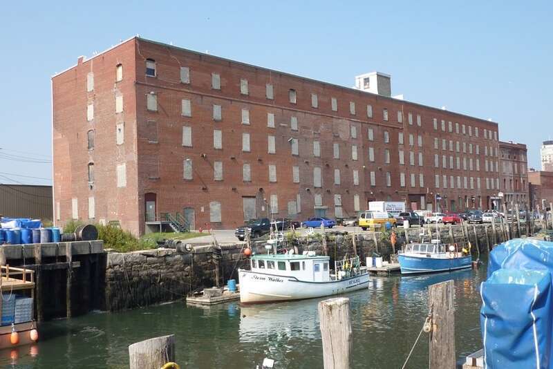 The Wharf's windows were blocked in the early 60's when used for cold storage.