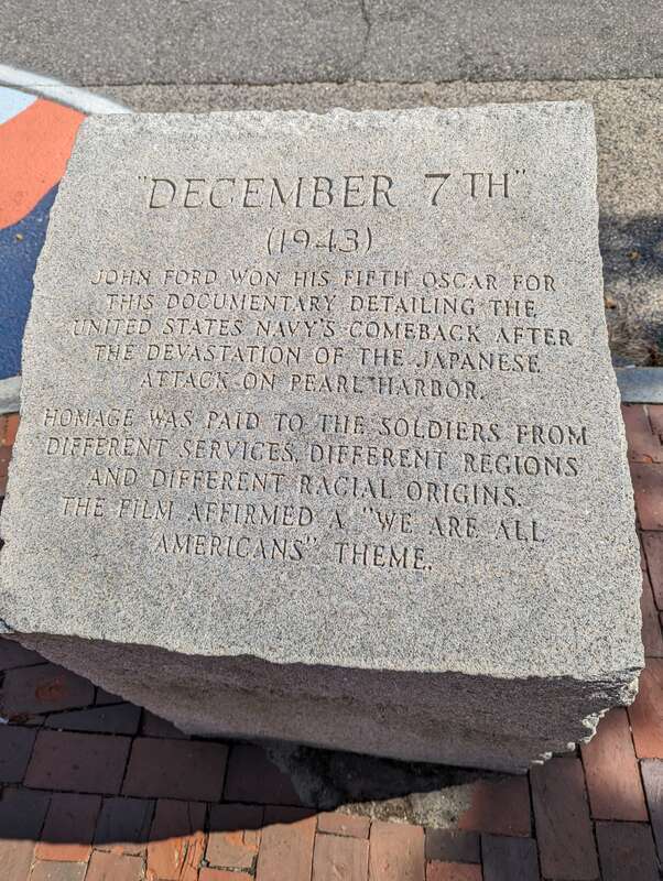 Stone inscription for "December 7th" (1943) at John Ford's statue in Portland, Maine