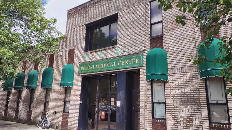 Looking east across Avenue A sidewalk at medical office building