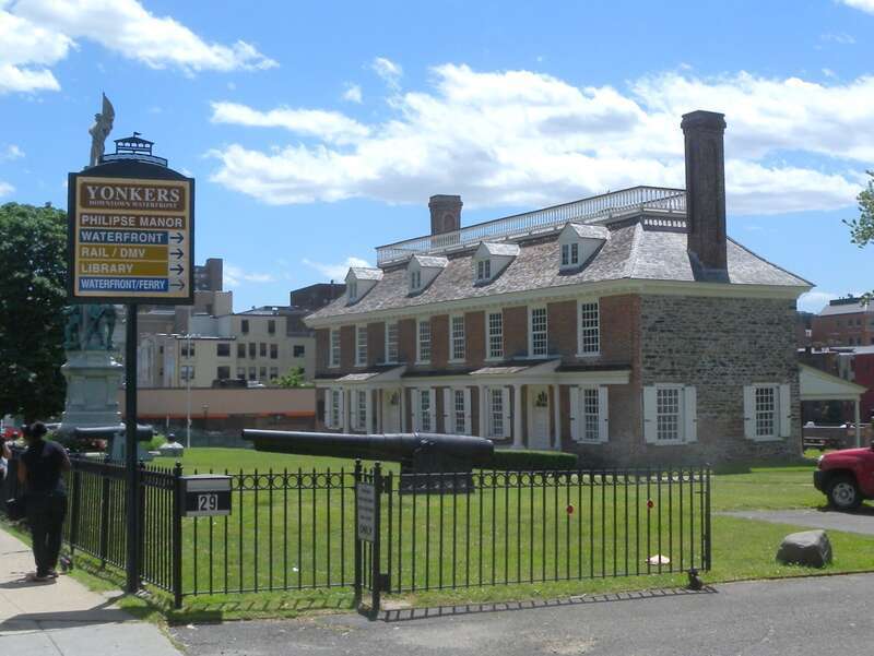 Looking southwest from Wharburton Avenue at Philipse Manor on a sunny early afternoon.