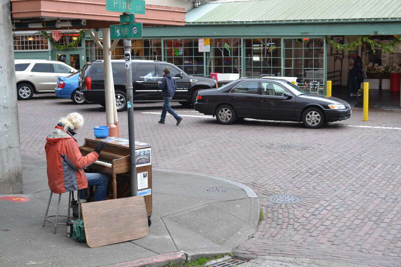 Johnny Hahn playing in Pike Place Market (Seattle, Washington) at the corner of Pine Street and Pike Place.