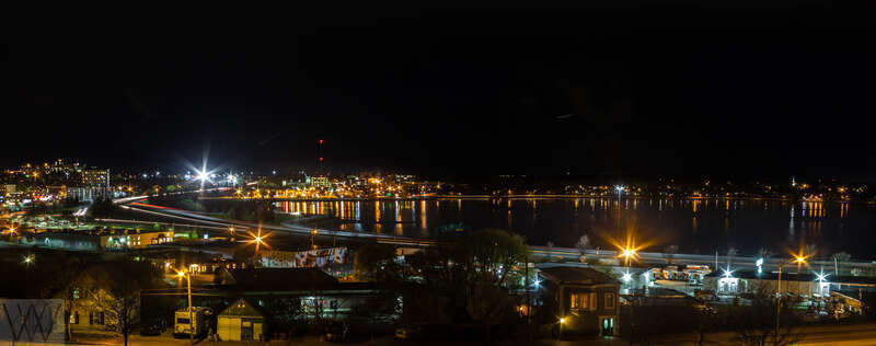A two image panorama, merged in Lightroom, of the Back Basin section of Portland, Maine.  It was taken from an open garden space along North Street.  In the sky is a short trail of a jet that had just taken off from the Portland Jet Port.

The Back