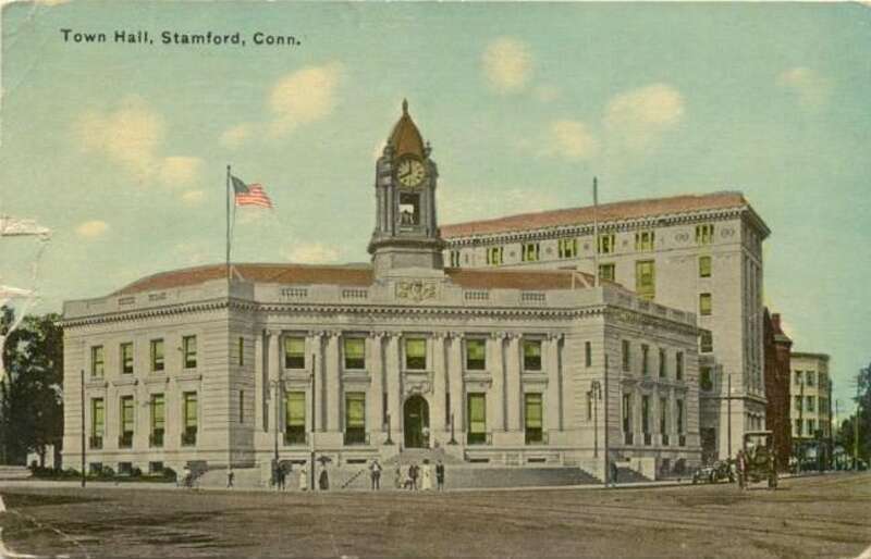 Postcard picture of Town Hall in the Downtown Stamford section of Stamford; store Web page states: "Stamford CT c1914 Postcard"; the Beaux Arts building looked much the same as of July 2008, the tall building behind it is gone, but the two buildings