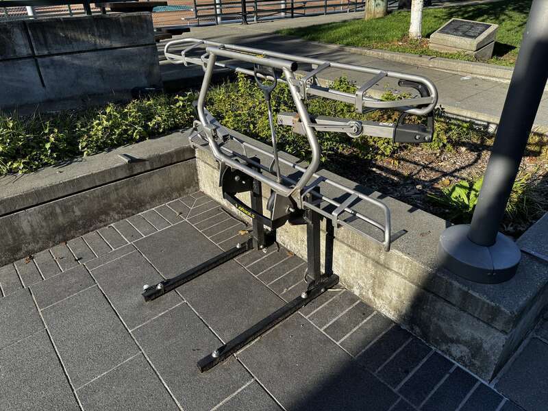A standalone version of a bicycle carrier typically seen on the front of city buses.