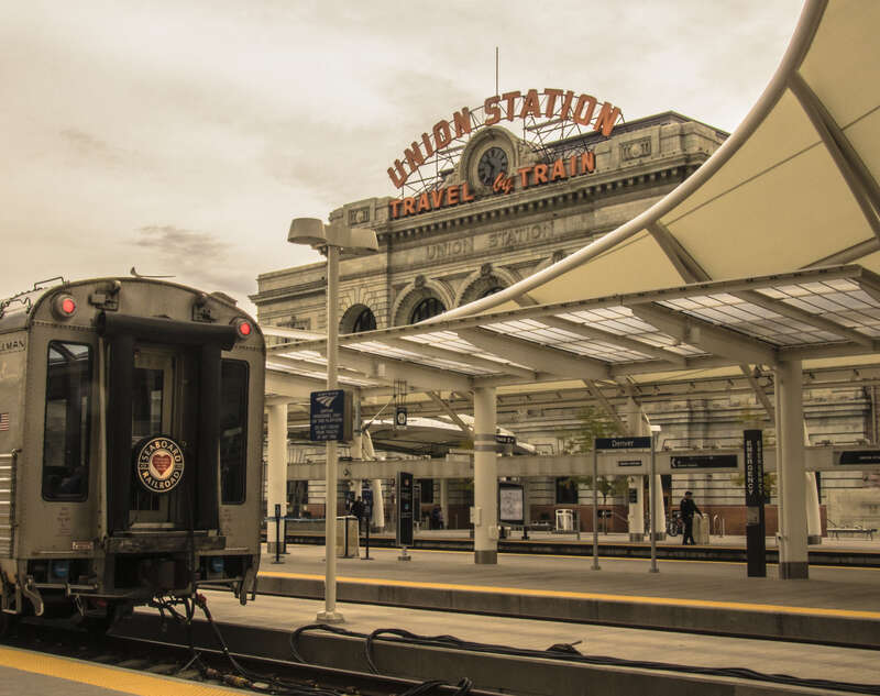 A view of Denver's Union Station from the railroad tracks.