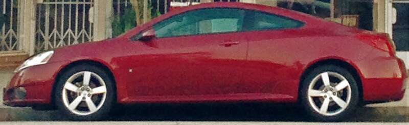 Red Pontiac G6 Coupe with big bad racing body kit.