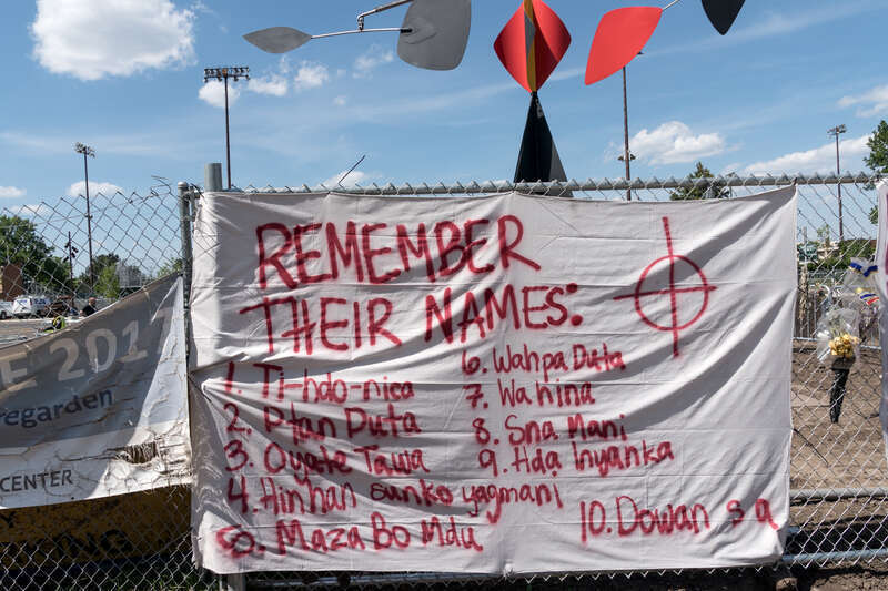 Remember Their names, a sign on the perimeter fence around the Walker's sculpture garden that lists the Native American's executed on December 26. 1862.
Photograph by Lorie Shaull.
"Scaffold," a wood &amp; steel sculpture by the artist Sam Durant,