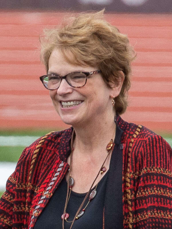 Brown President Christina Paxson honors Richard Gouse '68, the primary donor of the new Richard Gouse Field at Brown Stadium. Ceremony during halftime of the first game on the new field, 18 September 2021.
