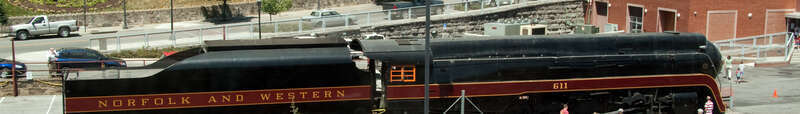 Shot from a pedestrian crossover, N&amp;W 611 sits in front of the Hotel Roanoke (in the background) and the former N&amp;W passenger station (on the right) on National Train Day 2010.