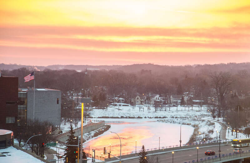 3rd Ave SE in Rochester, Minnesota at the junction of the Zumbro River and Bear Creek at sunrise.