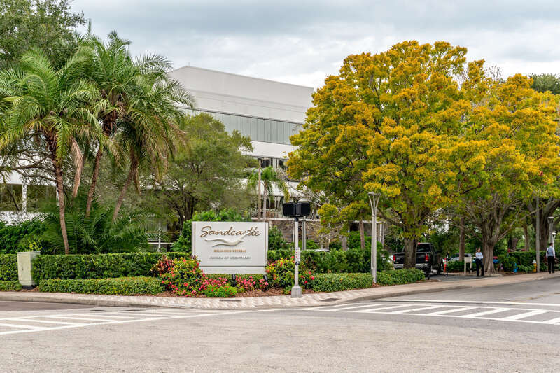 Located at 200 N Osceola Ave, the Sandcastle Religious Retreat is operated by the cult of Scientology in Clearwater, Florida. SeaOrg members stand guard outside.