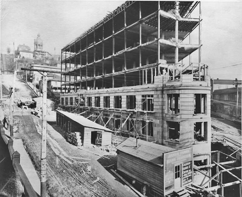 This building at 5th and Yesler served as Seattle's City Hall from 1909 until 1916. As of 2009 it is known as the Old Public Safety Building. In the background are several buildings now replaced by Interstate 5 and, in the furthest background, the
