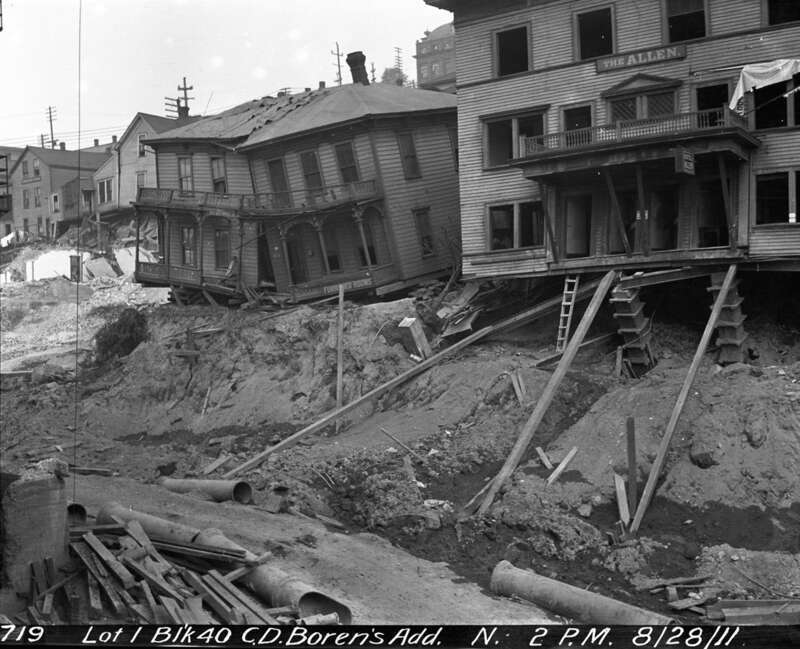 Condemned buildings on 5th Avenue near Terrace Street, Seattle, Washington, U.S. 1911. This was the result of some poorly executed regrading.

Presumably related to this. Item 52191,  Engineering Department Photographic Negatives (Record Series