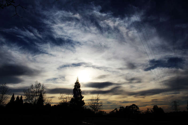 
500px provided description: Silver Skyline [#Landscape ,#Blue ,#White ,#Sun ,#Cloud ,#Sky ,#Light ,#Sunset ,#Clouds ,#Beautiful ,#Evening ,#Skyline ,#Dark ,#Pretty ,#Silver ,#Glowing ,#Cloudscape ,#Sun Behind Clouds]