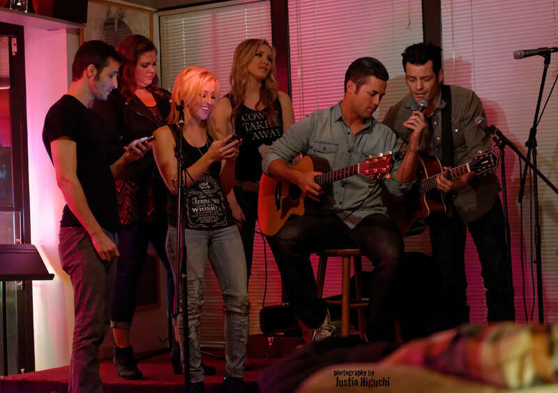"NAMM Week: Songwriter Series" Songwriters Round at The Ugly Mug Cafe in Orange CA on January 22nd, 2014. Kaela Kinney (tall blonde), Ry Bradley (right), Ryan Terrigno (left), Katelyn Marie (Jack Daniels tshirt), Heidi Howard (dark hair), and Scott