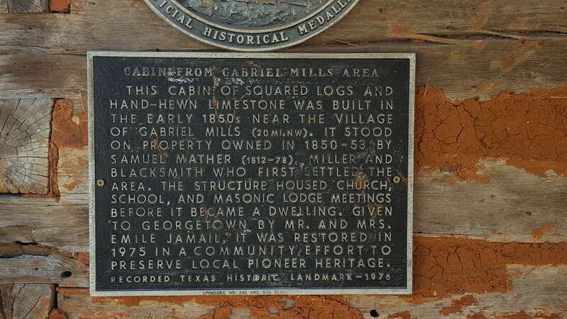 Marker describing the cabin of squared logs and hand-hewn limestone built in the early 1850s near the village of Gabriel Mills, Texas.  It stood on property owned in 1850-53 by Samuel Mather (1812-78), miller and blacksmith who first settled the