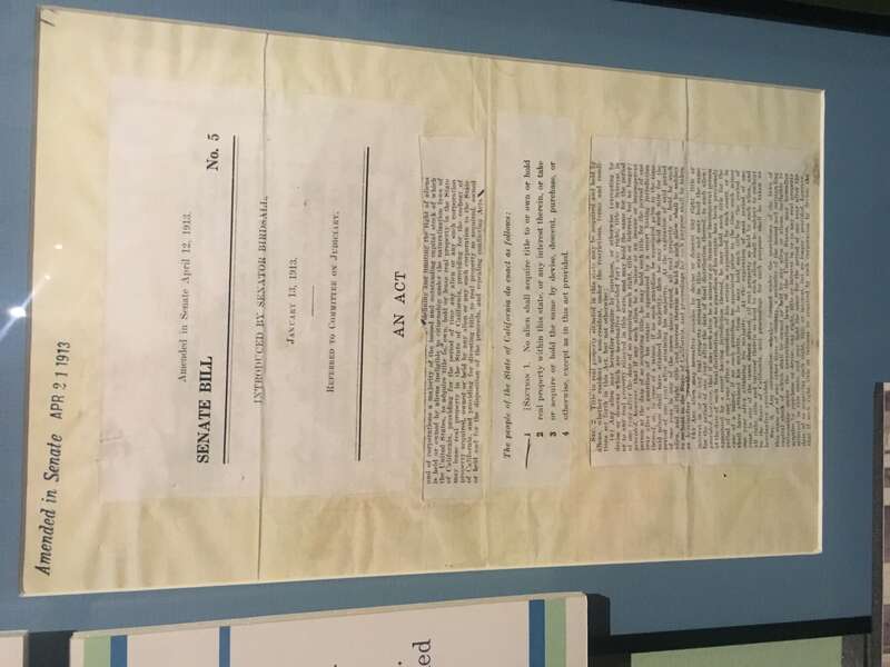 A copy of the state Alien Land Law, that barred asian immigrants from buying land, on display from the CA State Archives, as part of the "Uprooted! Japanese Americans During WWII" exhibit on the first floor of the The California Museum.