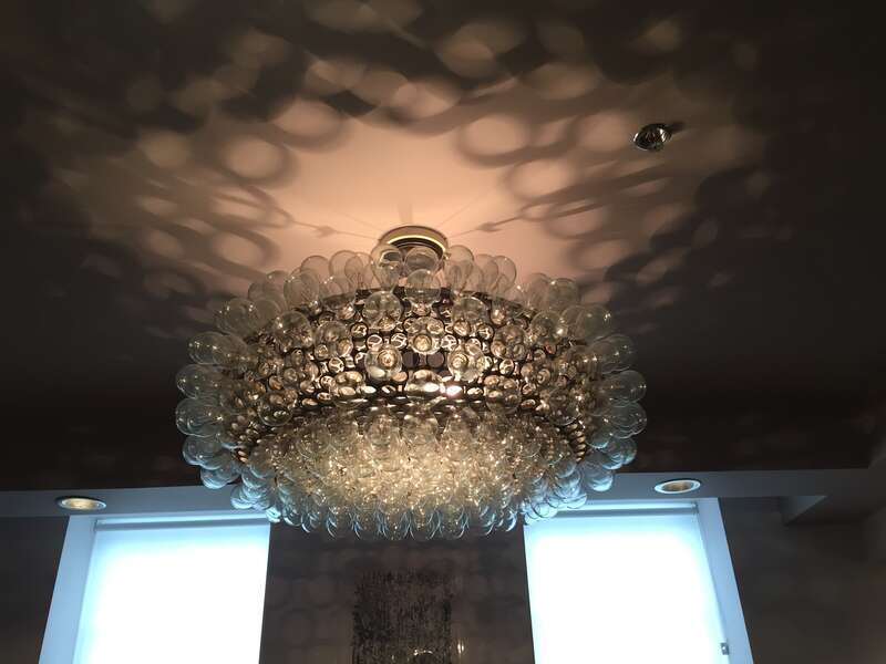 The Edison Cloud is created from formed aluminum rings clear custom-made incandescent bulbs. Derived in form from the original designs and molds from The Pool, it is a beautiful example of recycling beauty and function. The fixtures, handmade in