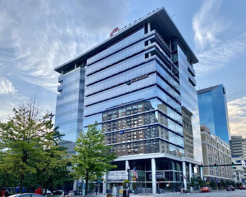 Built in 2019, this Contemporary mid-rise building was designed by Rabun Architects as a mixed-use office, retail, and hotel complex in Downtown Lexington.  The building features a glass-clad exterior with metal panel trim, large cylindrical