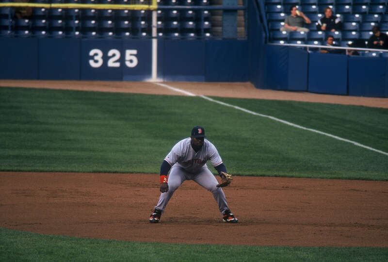 Mo Vaughn playing first base for the Boston Red Sox at Tiger Stadium on an unknown date in 1998, probably April 21.