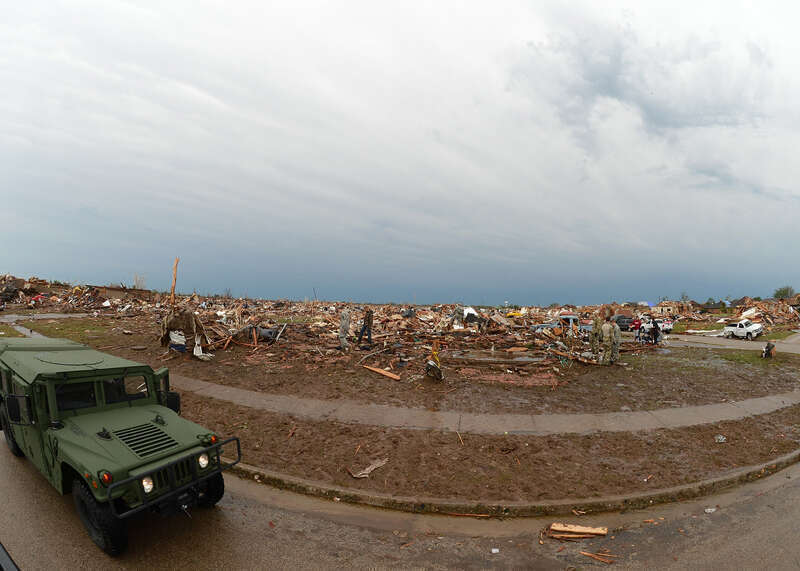 After the devastating tornadic activity in Moore, Okla., a military and law enforcement presence helps to curb loitering and maintains security in the area May 21, 2013. This established housing addition is now a wasteland after a massive tornado hit