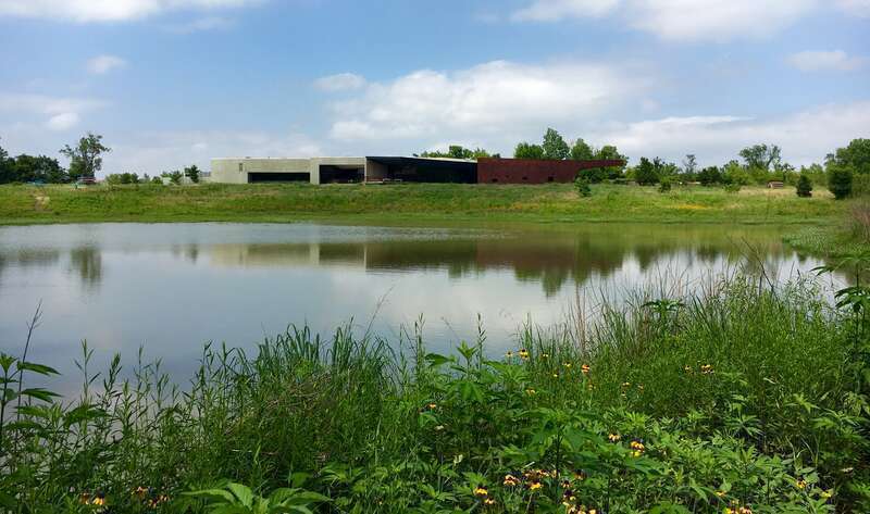 Trinity River Audubon Center viewed across adjacent pond