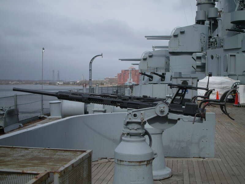 These are the 20mm Oerlikons that are dotted throughout the ship. 20mm is nearly 1" diameter.