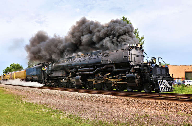 Union Pacific 4014 "Big Boy" (Alco 4-8-8-4) is Eastbound on the UP Clinton Sub seen here at the Kellogg Avenue Crossing North of Gilchrist Street in Ames, Iowa.
Car/Power List:
4014 - Alco 4-8-8-4
814 - Joe Jordan
809 - Jim Adams
3025 -
