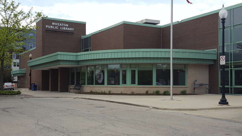 A view of the main entrance of Wheaton Public Library from the parking lot.