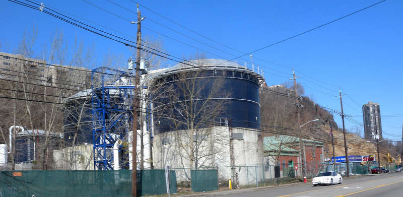 Looking northwest across River Road at Woodcliff Treatment Plant on a sunny midday.