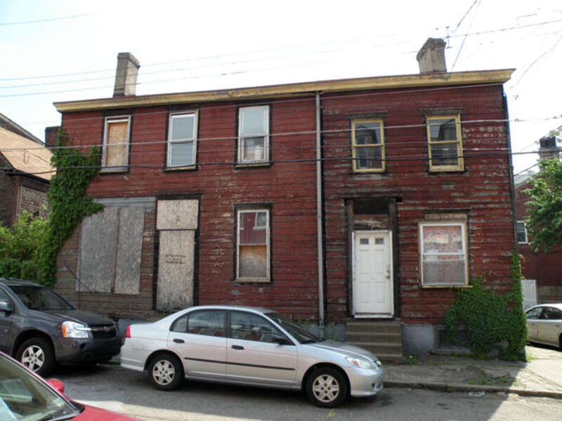 Picture of the front of 184 38th Street (also known as McBride Log House) in the Lawrenceville neighborhood of Pittsburgh, Pennsylvania, on May 21, 2011.  The log house dates back to the 1820s, and was supposedly the oldest known log house that