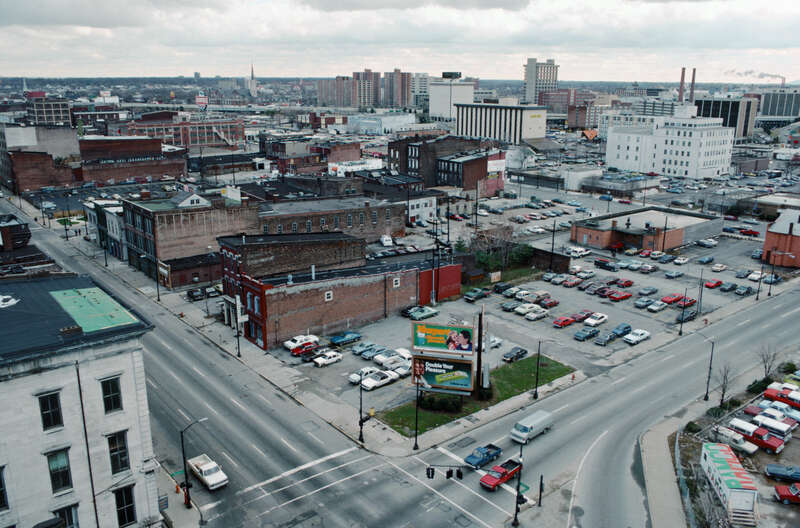 Looking SE from roof of Farm Credit Banks building on north side of Main St. between 2nd and 3rd Sts.
In foreground, intersection of 2nd and Main Sts.
At lower left, part of building (NE corner 2nd and Main) which housed headquarters of <a