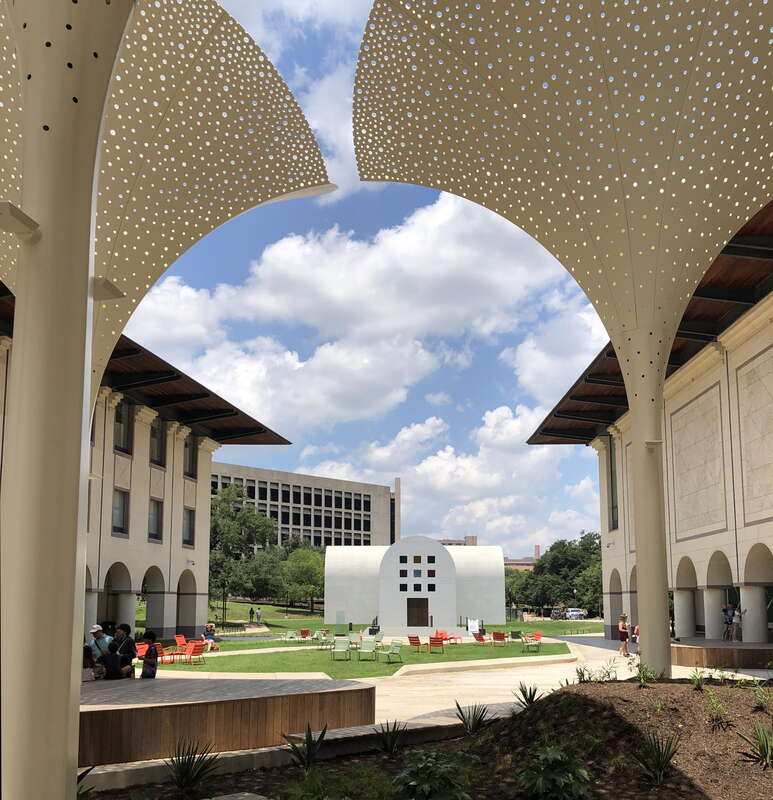 Exterior grounds and plaza designed by Snøhetta at the Blanton Museum of Art in Austin, Texas. Features include twelve towering, three-stories-tall "petals" which provide perforated shade. In the center of the photo is Ellsworth Kelly's Austin