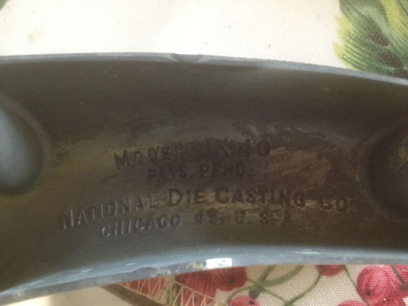 Underside of Juice King model JK-40 juicer showing model number and manufacturer information "Model JK-40 PATS. PEND. National Die Casting Co. Chicago 45, U. S. A.