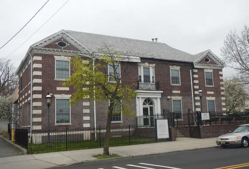 Looking northwest across Summit Avenue at Newark Public Library North End Branch on a cloudy afternoon.