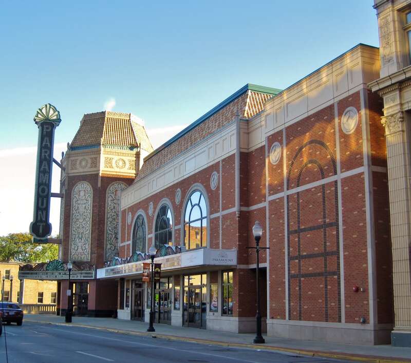 Paramount Theatre in Aurora (1931). It was part of a string of theaters commissioned by Paramount Pictures that were built to cater to the new "Talkies". It was the first air conditioned building in the state outside of Chicago. The Marx Brothers,