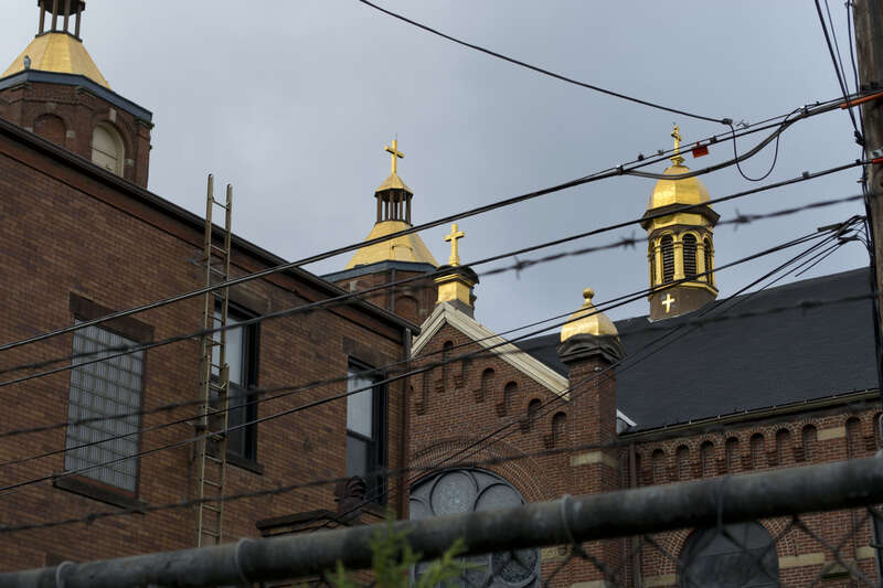 500px provided description: A Polish church in the Strip District, Pittsburgh. [#city ,#church ,#buildings ,#urban ,#architecture ,#roof ,#gold ,#usa ,#brick ,#strip ,#district ,#pennsylvania ,#united states ,#catholic ,#crosses ,#pittsburgh