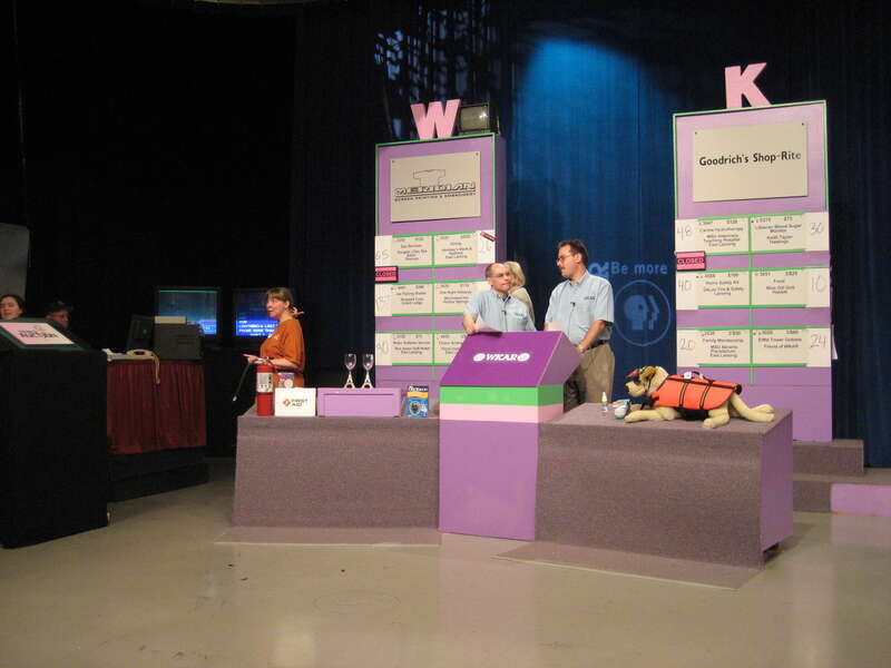 Sale boards set up ready to go.  The items on the right table go with the W board on the left.  The Items on the left table go with the K board on the right.  That way the camera showing the high bids don't interfere with the camera showing the